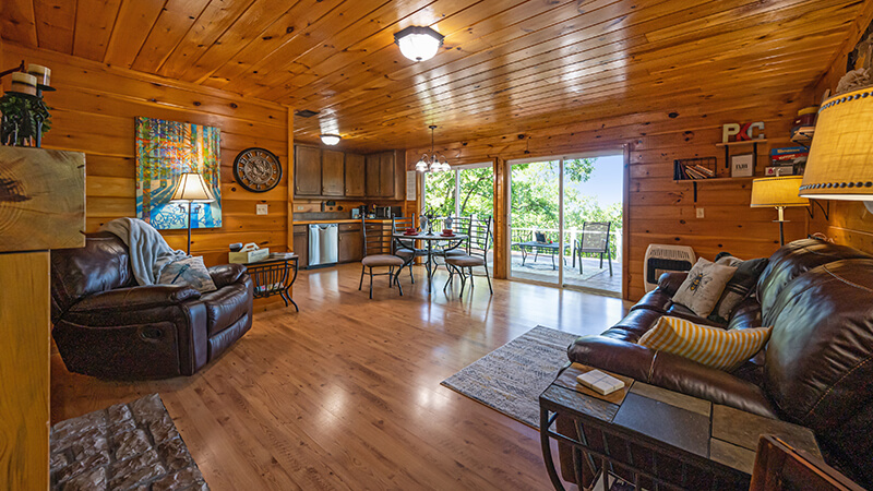 Open living and dining area with large double sliding doors onto the patio that has the best sunset view in Oklahoma.