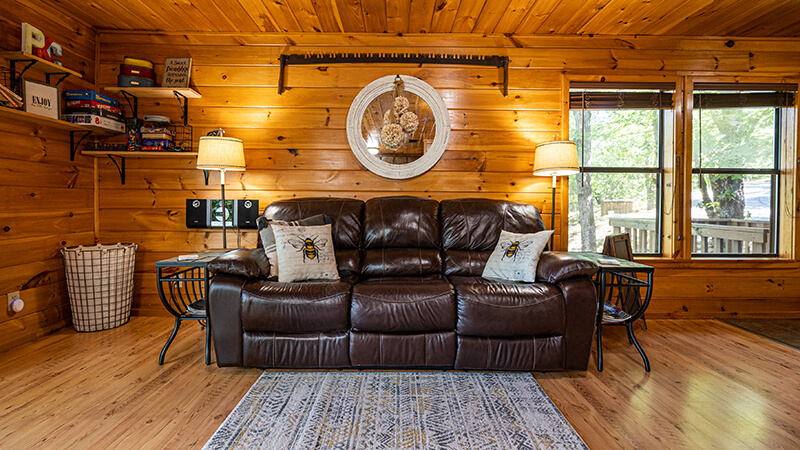 Guests sink deeply into the comfort of the Sunset Cabin at Peckerwood Knob Cabin Rentals.