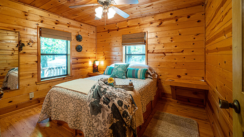Comfortable beds and amazing sunset views await our guests at the Sunset Cabin of Peckerwood Knob Cabin Rentals in Oklahoma/