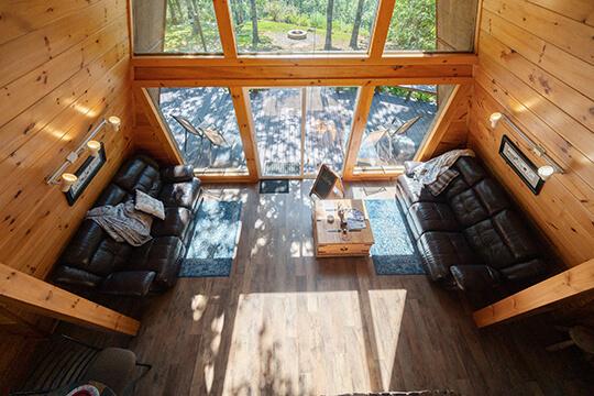 Comfortable and cozy sofas make relaxing easy at the Sunrise Cabin at Peckerwood Knob Oklahoma Cabin Rentals