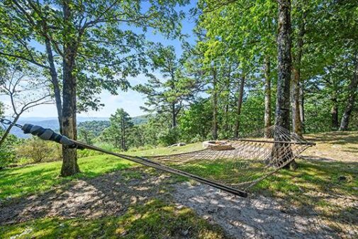 Relax the morning away swinging gently in the wind on your private hammock outside the Sunrise Cabin at Peckerwood Knob Oklahoma Cabin Rentals