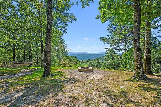 Swing in the breeze and enjoy the majestic views from the sunrise cabin at Peckerwood Knob Oklahoma Cabin Rentals