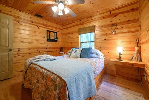 Two bedrooms with queen-size beds, topped with memory foam for ultimate comfort at Peckerwood Knob Cabin Rentals in Oklahoma