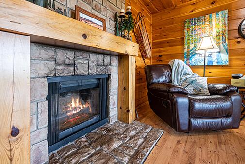 Relax by the fireplace at the Sunset Cabin at Peckerwood Knob Cabin Rentals in Oklahoma